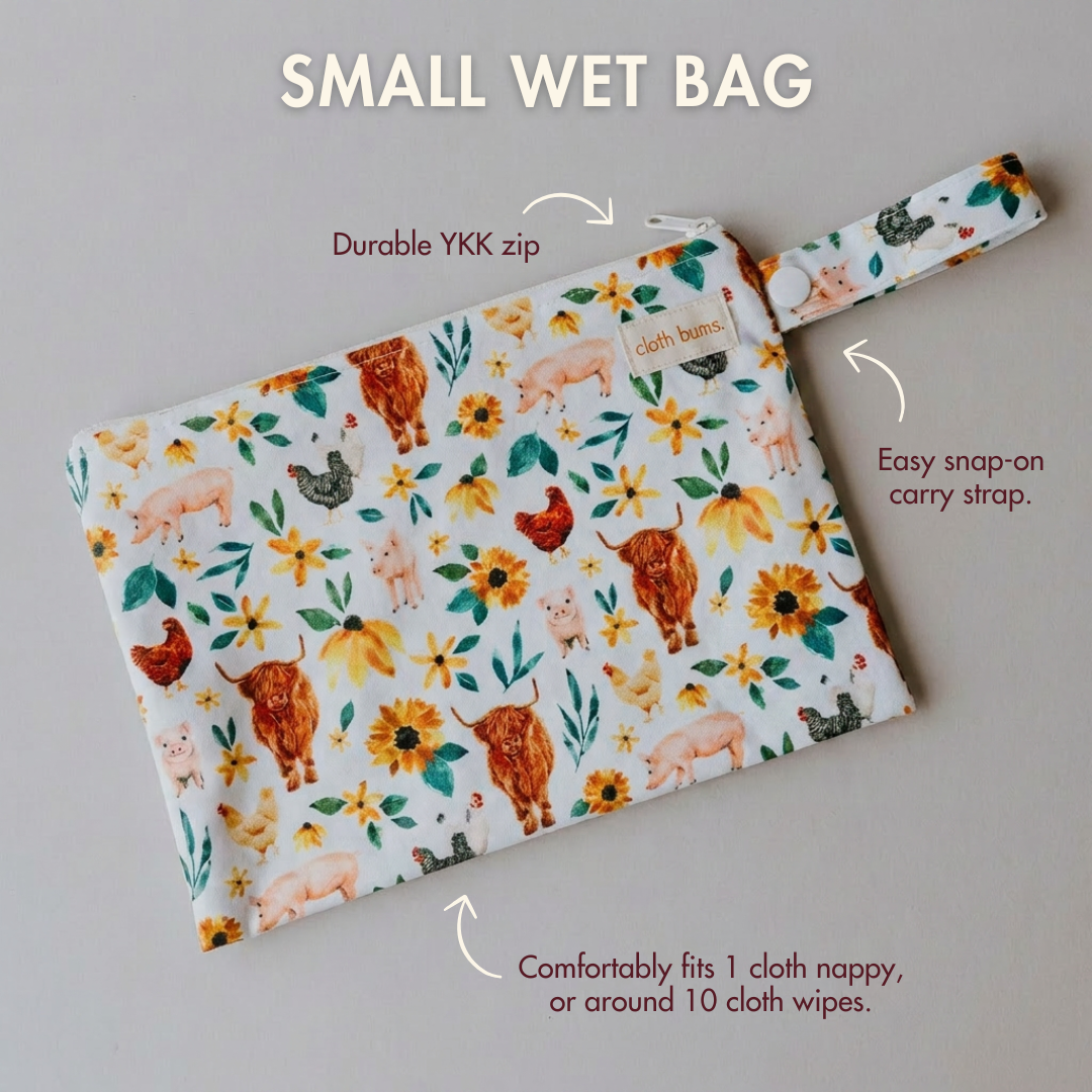 Small wet bag with animal and flower pattern on a gray background