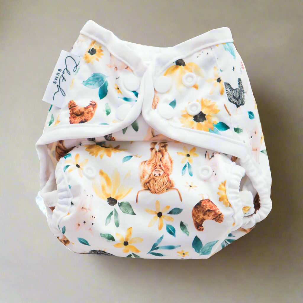 Newborn Reusable Cloth Nappy with Sunflowers and Cows Printed on the Nappy