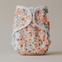 Floral patterned cloth diaper on a neutral background