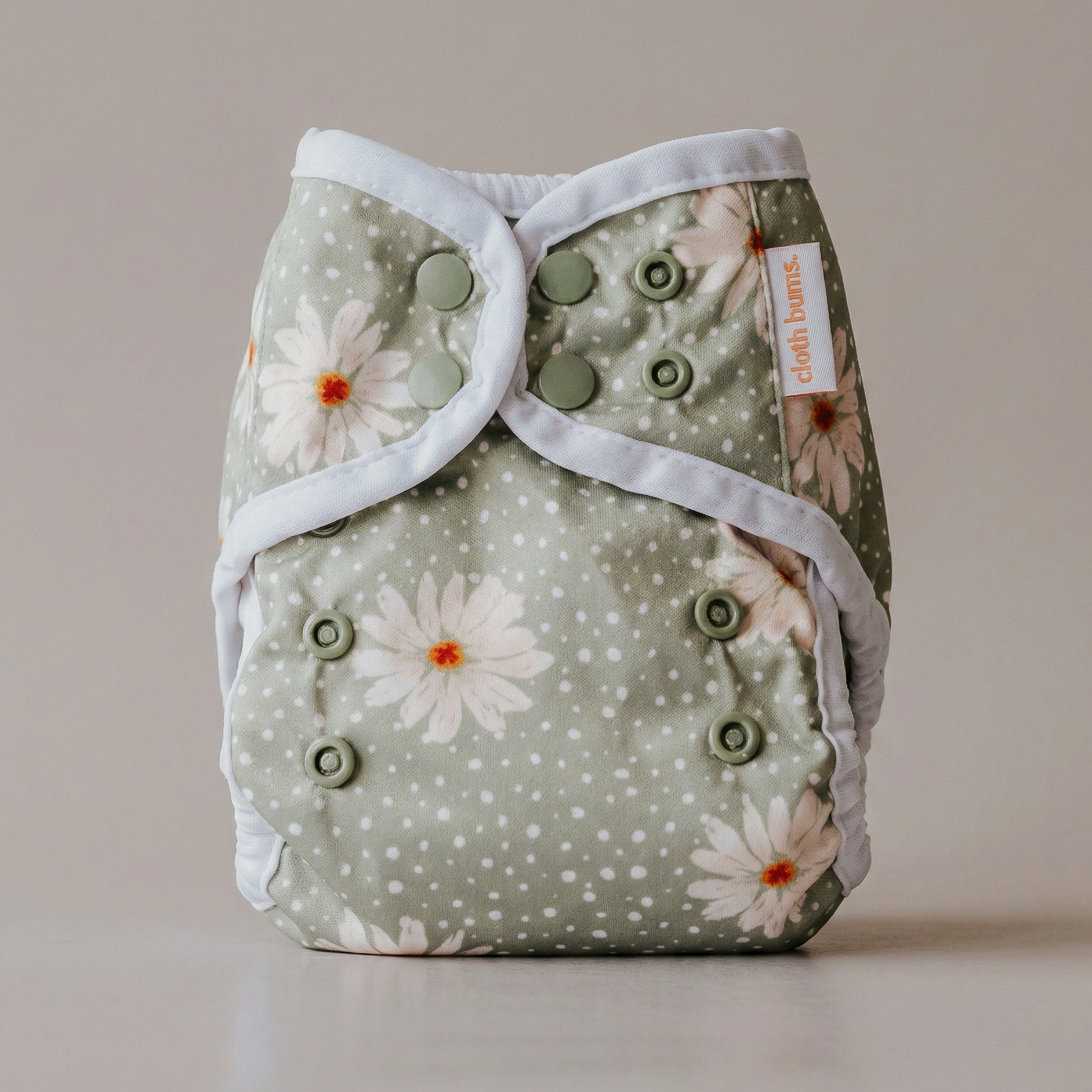 Floral patterned cloth diaper on a neutral background