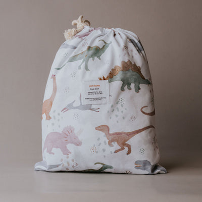 Cloth Bums Prehistoric waterproof fitted sheet on a bed