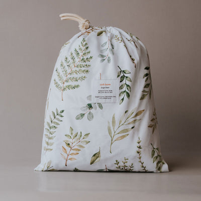 Cloth Bums Fern Gully waterproof fitted sheet on a bed