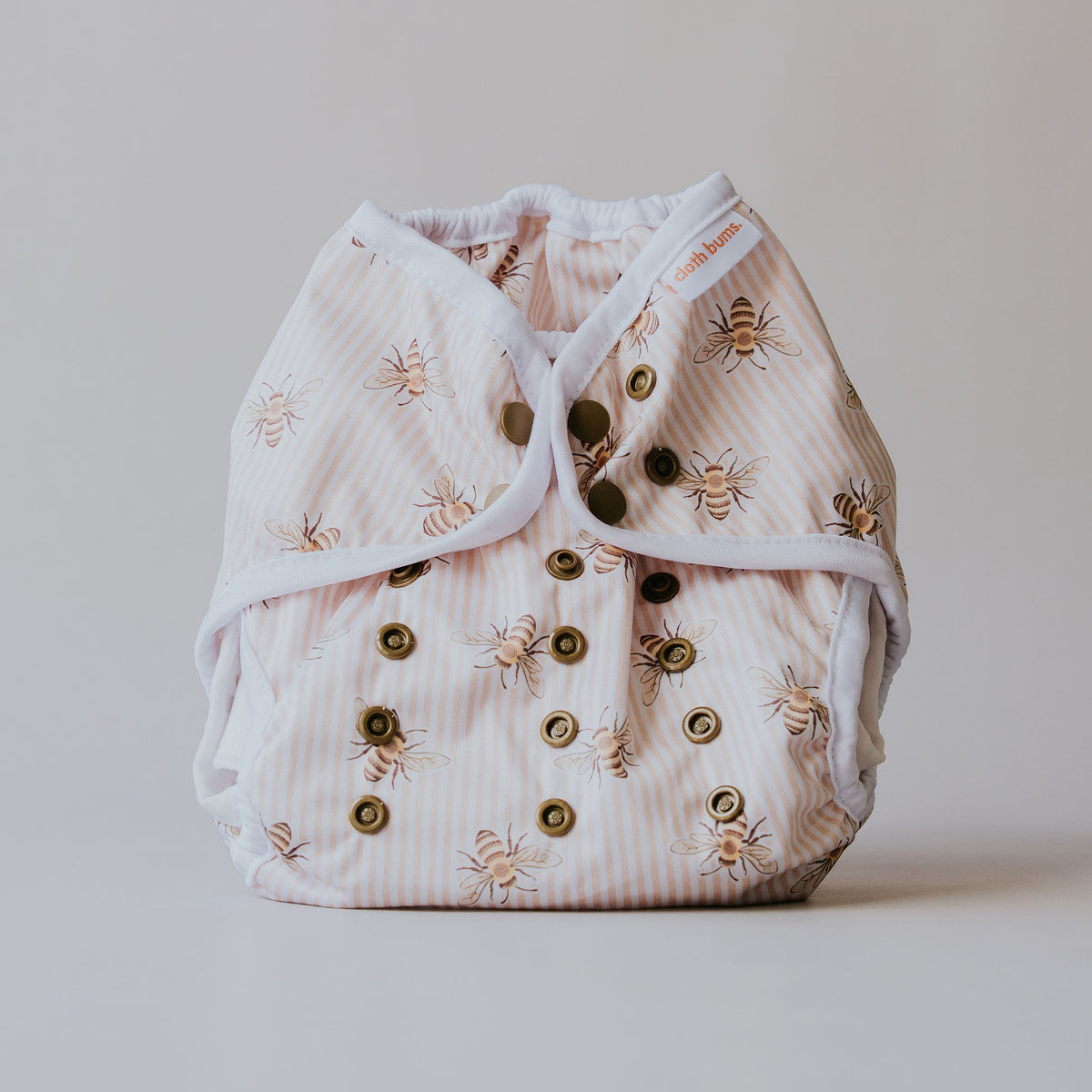 Dragon wrap nappy cover in Beeline print by Cloth Bums