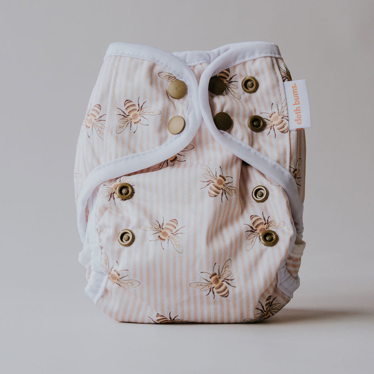 Fairy newborn nappy cover in Beeline print by Cloth Bums