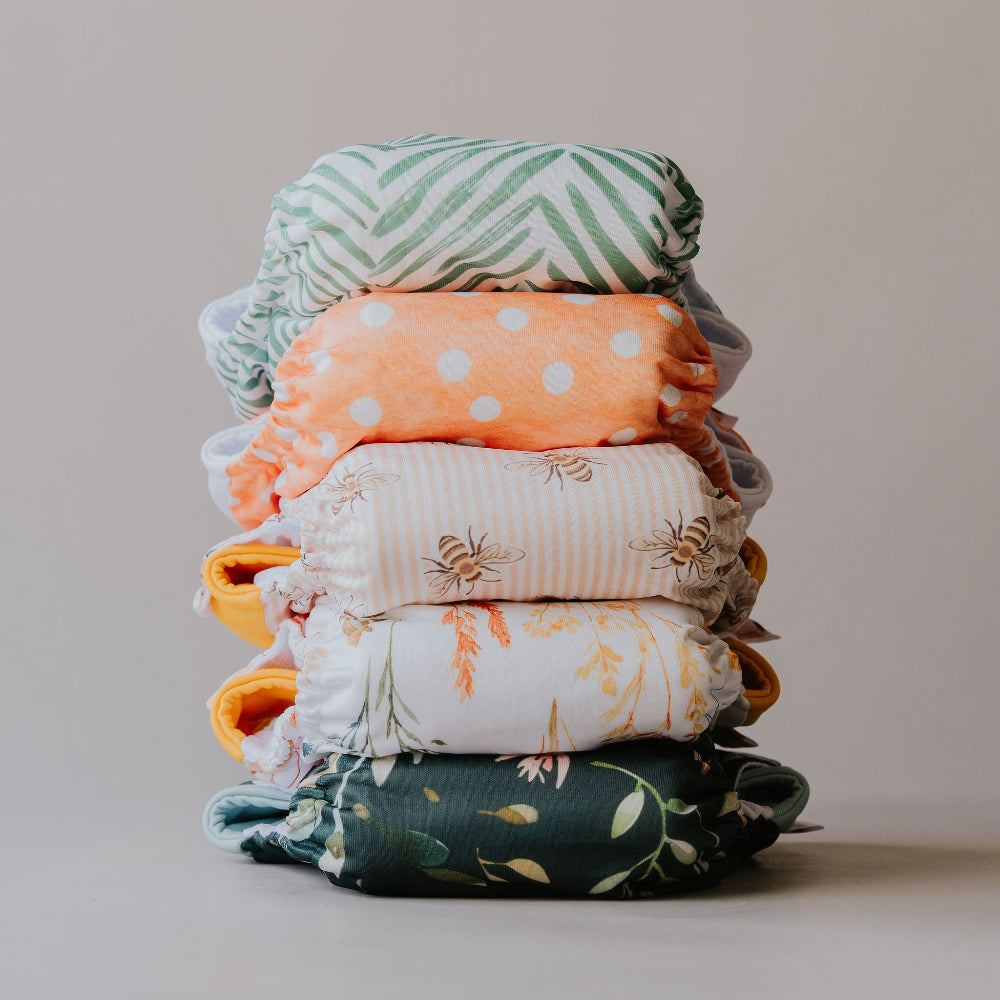Stack of Gremlin pull-up nappies in the five new prints, front view