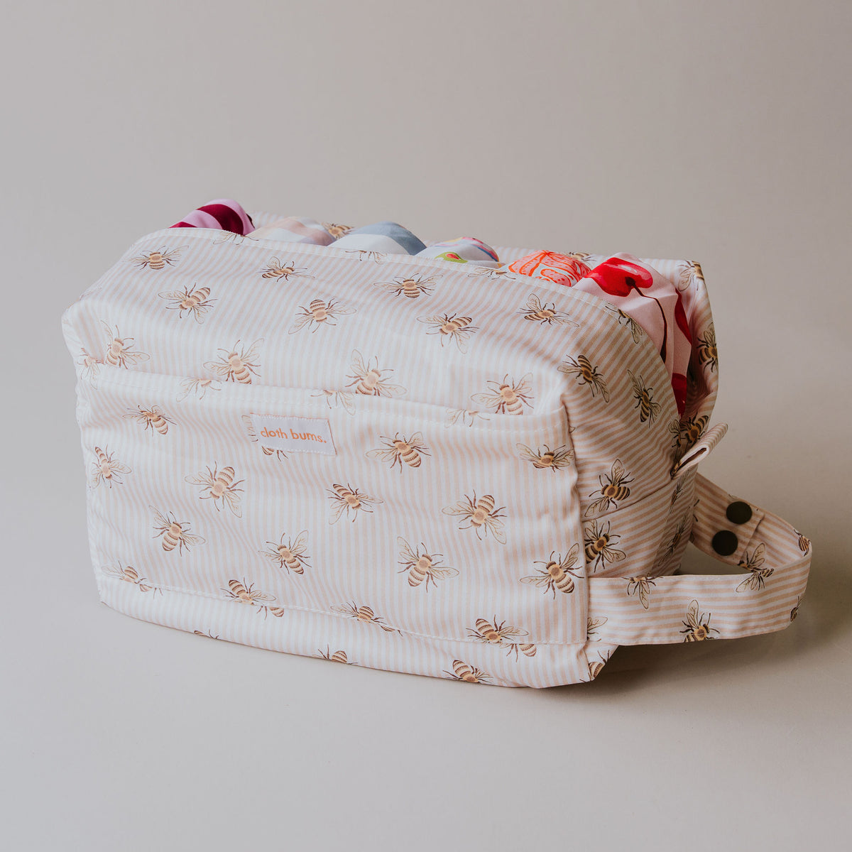Side view of the Beeline pod wet bag filled with cloth nappies
