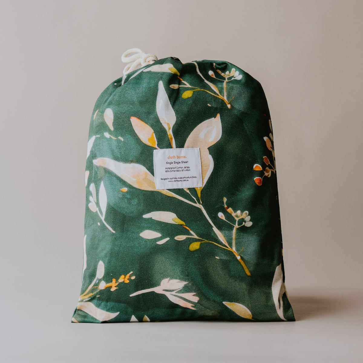 Single / king single waterproof fitted sheet in Evergreen print, packed in its drawstring bag