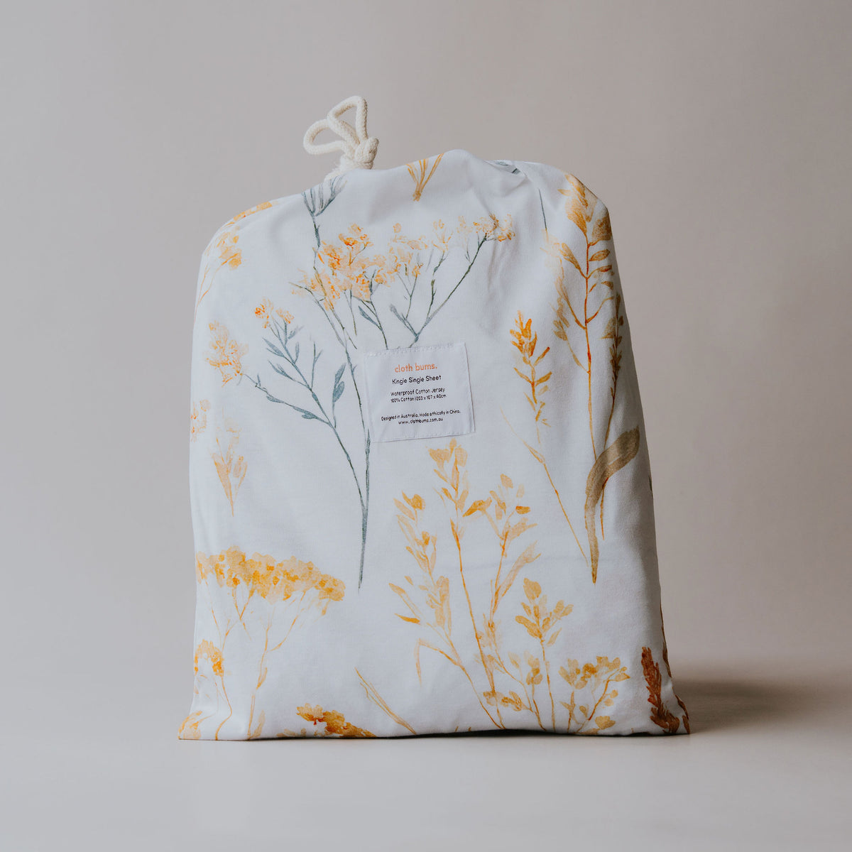 Single / king single waterproof fitted sheet in Wild Prairie print, packed in its drawstring bag