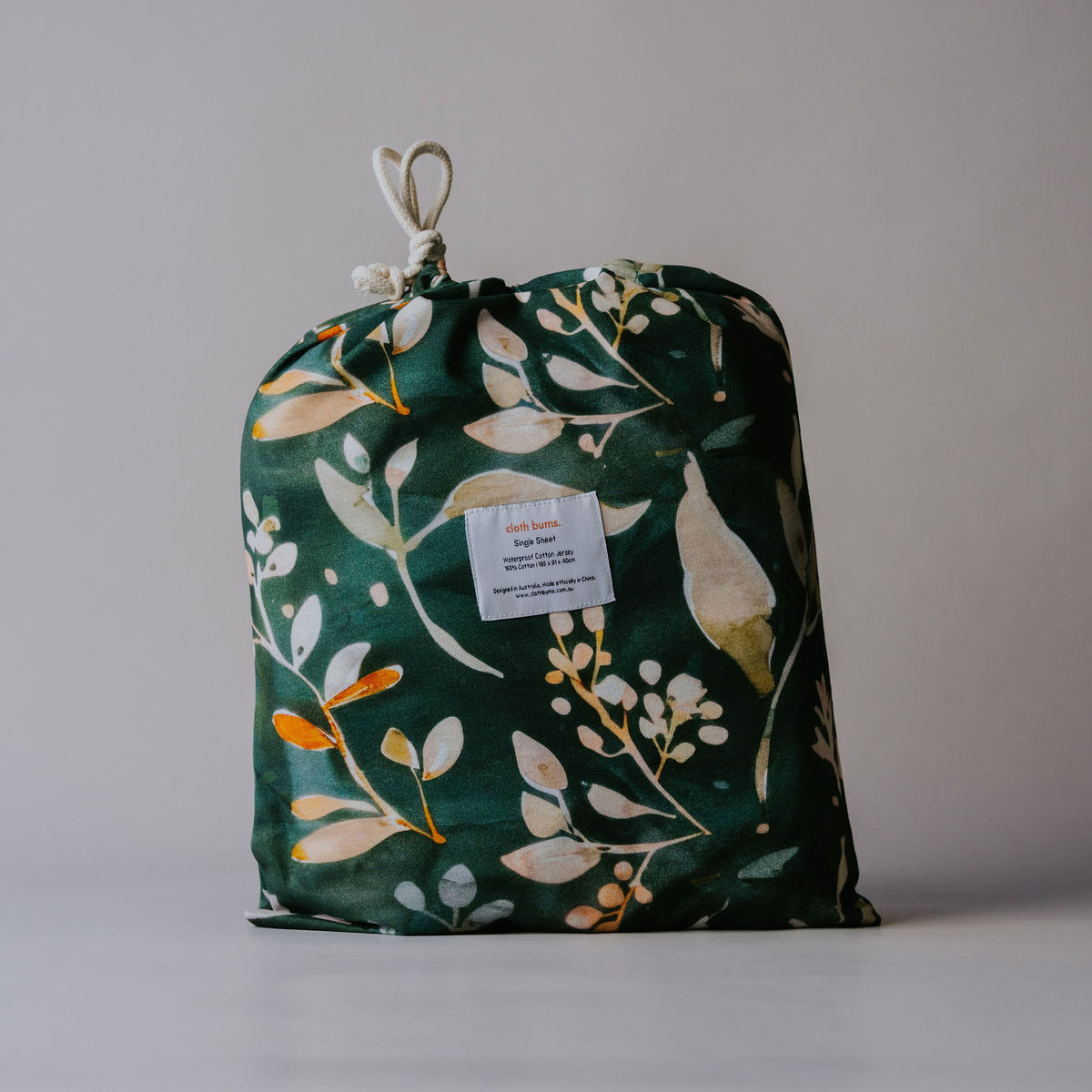 Single / king single waterproof fitted sheet in Evergreen print, in its drawstring bag
