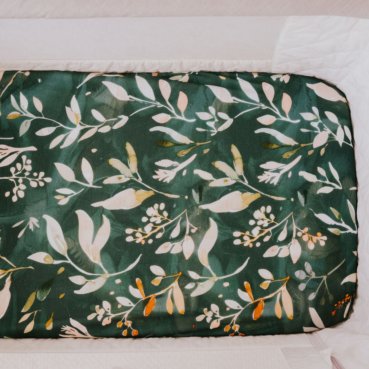 Bedside co-sleeper made up with the Evergreen waterproof sheet, seen from above