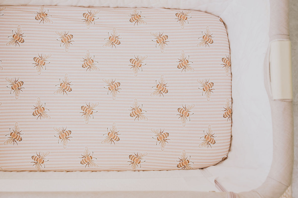 Close-up of the Beeline waterproof sheet fitted in a bedside co-sleeper