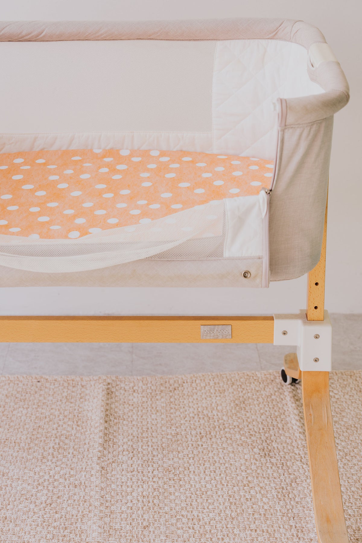 Bedside co-sleeper made up with the Marmalade waterproof sheet