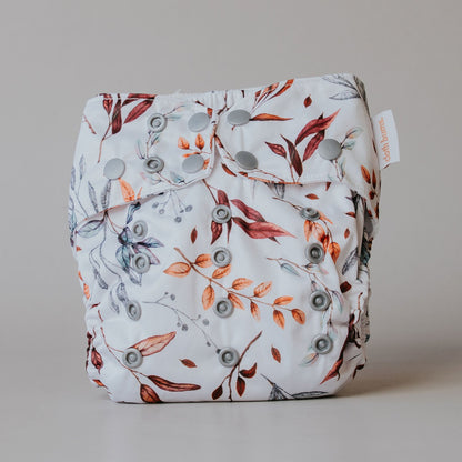 Floral-patterned cloth diaper on a plain background