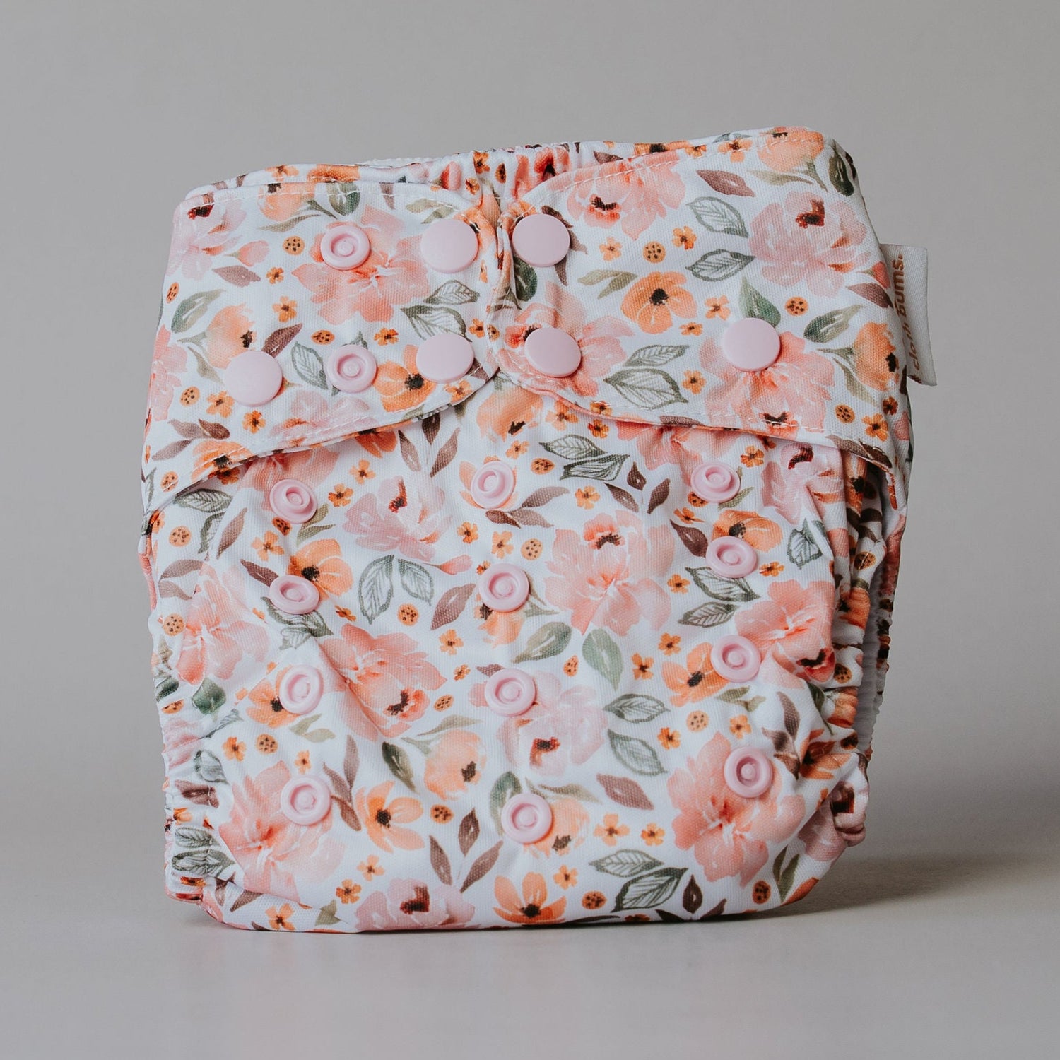 Floral-patterned diaper on a plain background