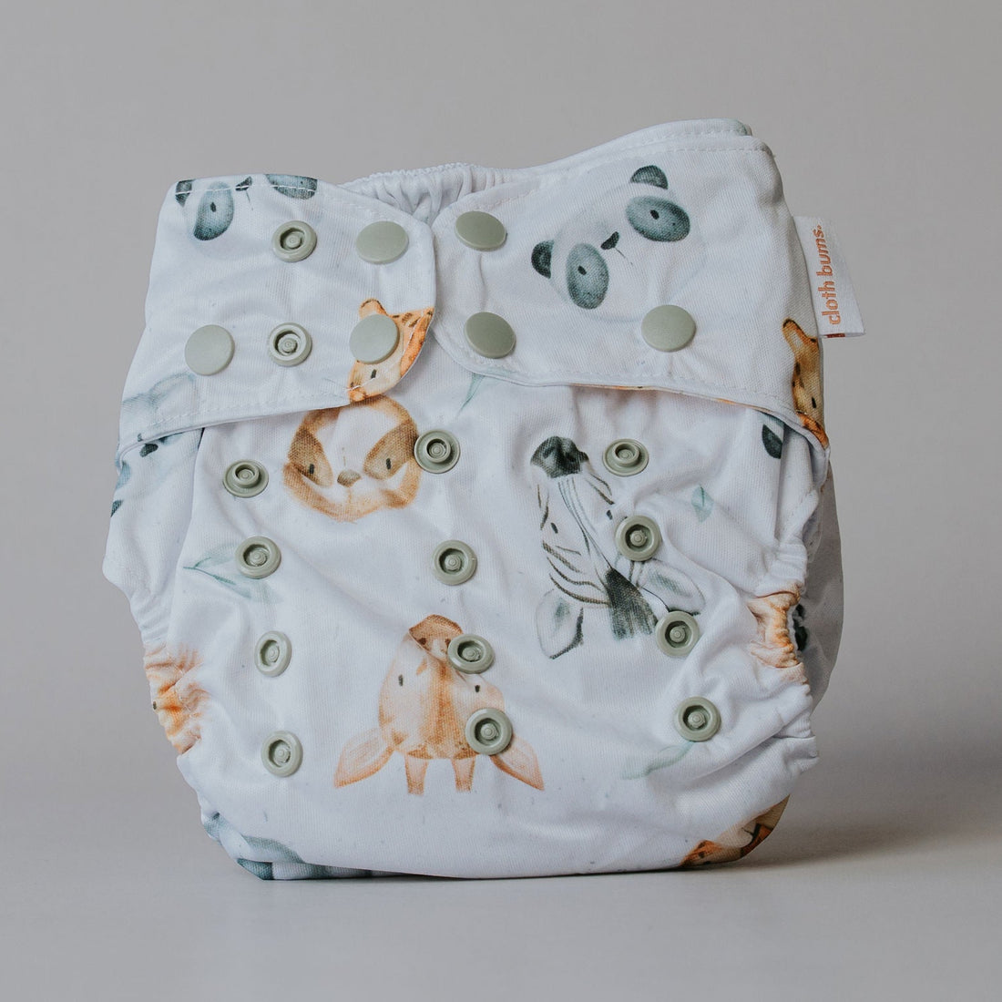 Baby diaper with animal pattern on a plain background