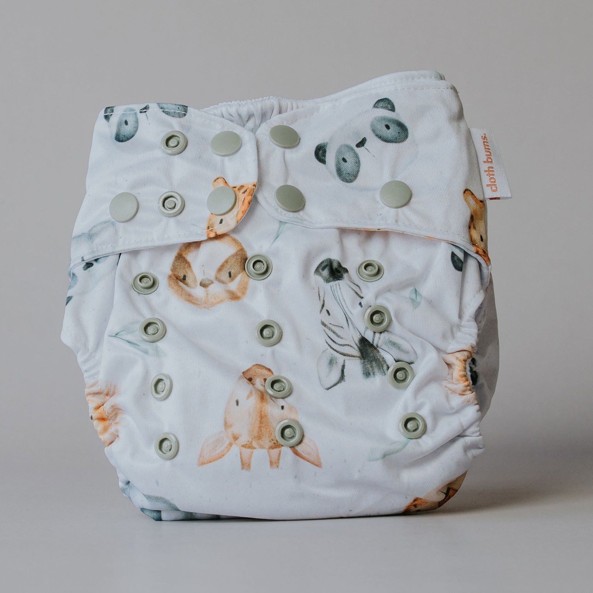 Baby diaper with animal pattern on a plain background