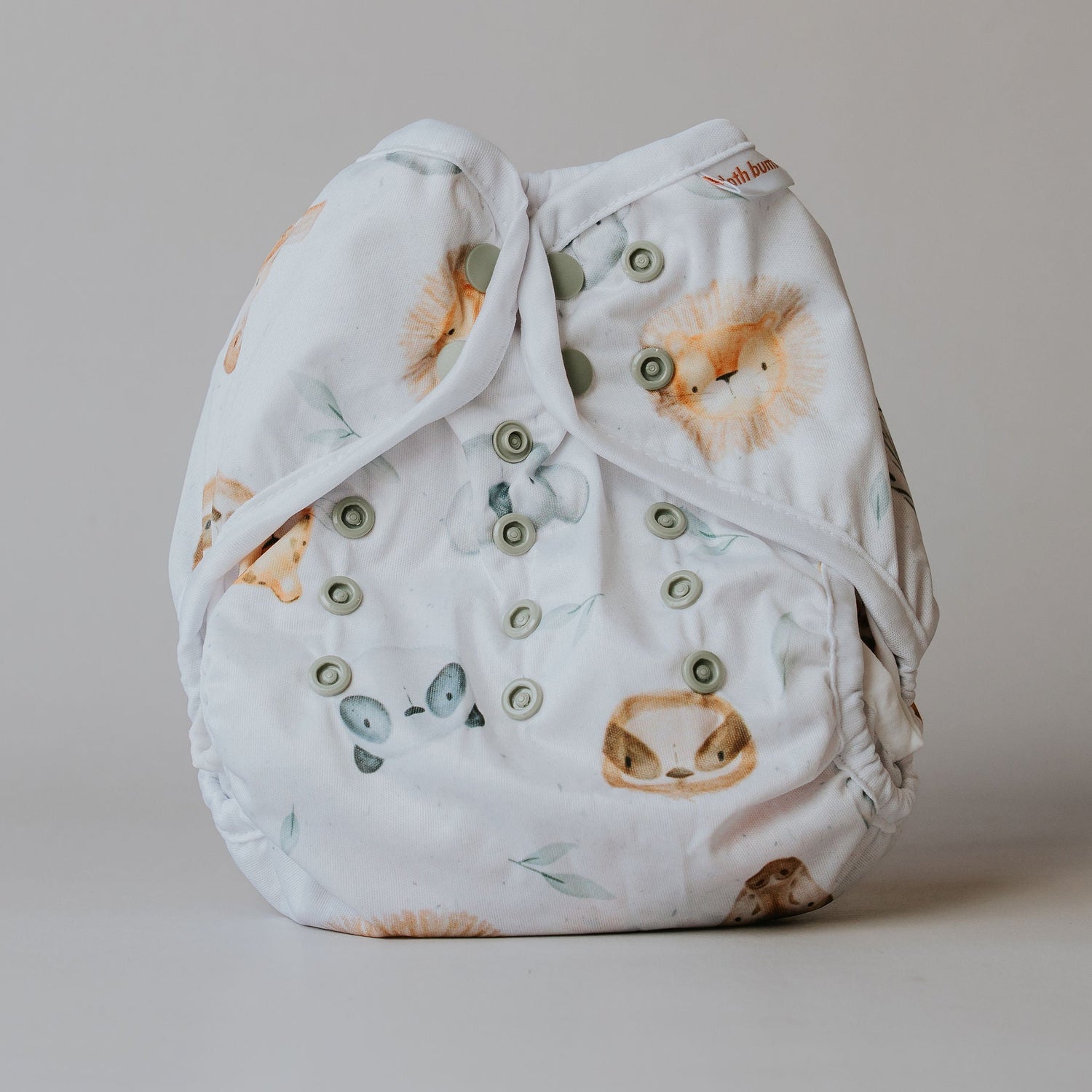 Baby diaper cover with animal pattern on a plain background