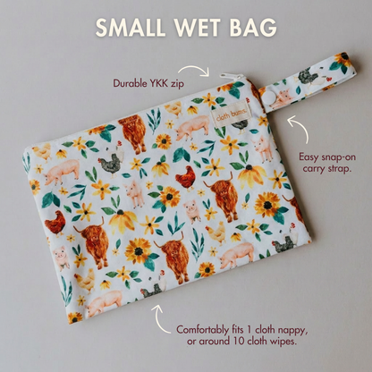 Small wet bag with animal and flower pattern on a gray background
