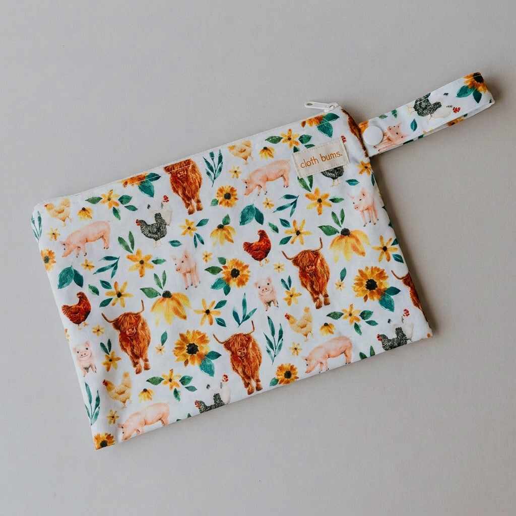 Reusable wet bag with an animal and floral pattern on a neutral background